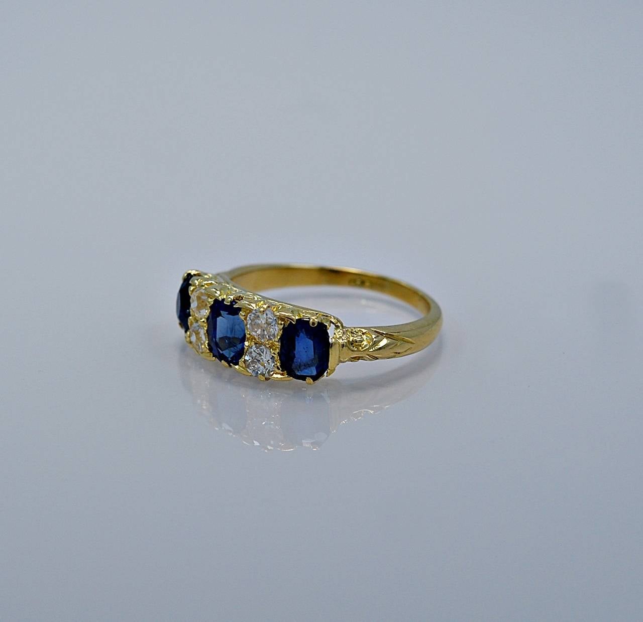 J35037

REASONABLE OFFERS CONSIDERED!

This spectacular Edwardian fashion ring or wedding band features 2.00ct. apx. T.W. of beautiful natural blue oval sapphires (which are unheated) and apx. .50ct. T.W. of round European cut diamonds. The