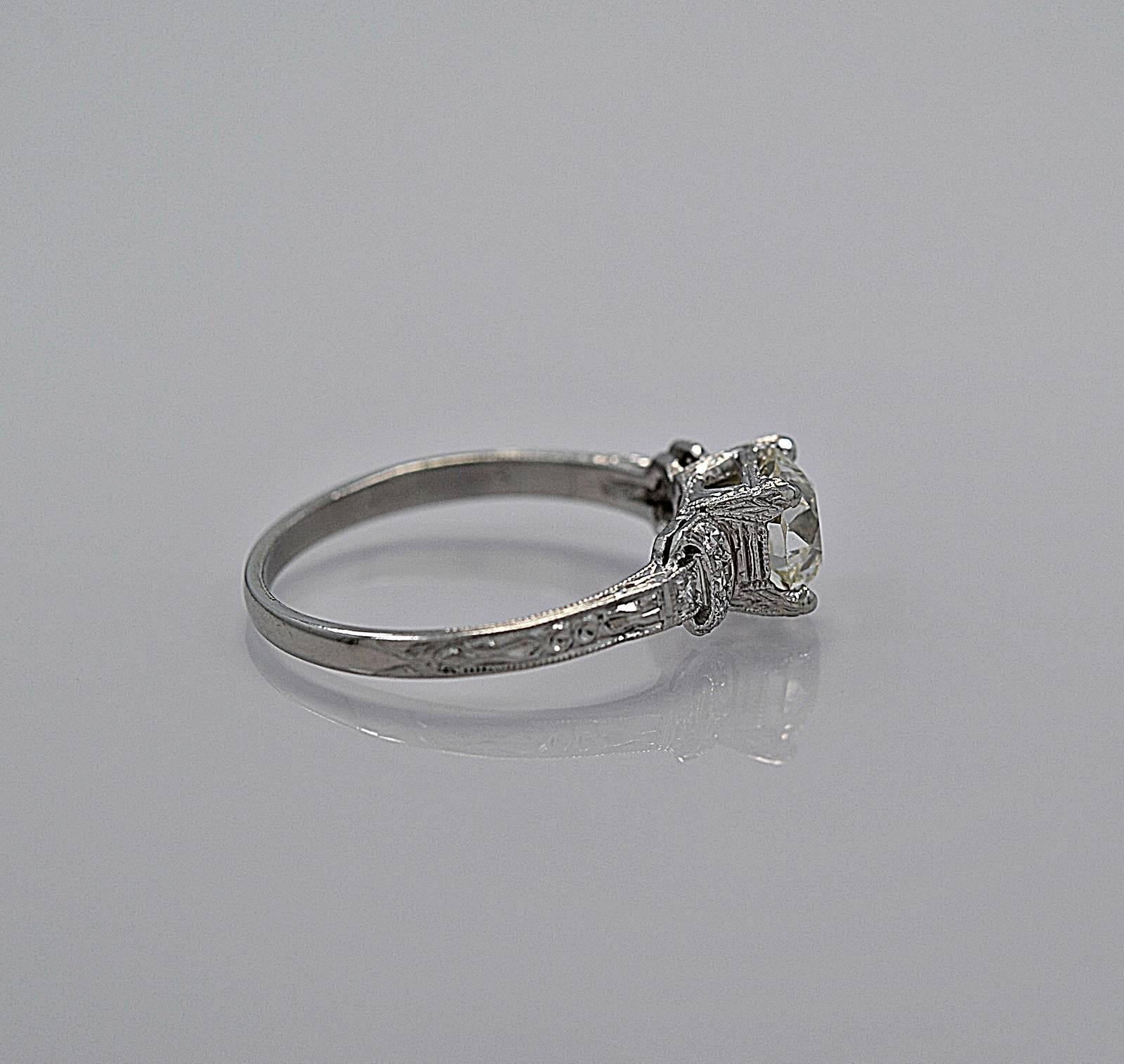 This Art Deco platinum and diamond Antique engagement ring is of exceptional elegance! It features a 1.16ct. diamond with a GIA certificate. The platinum mounting was largely handmade in the 1920's and has a wonderful design on the shoulders.