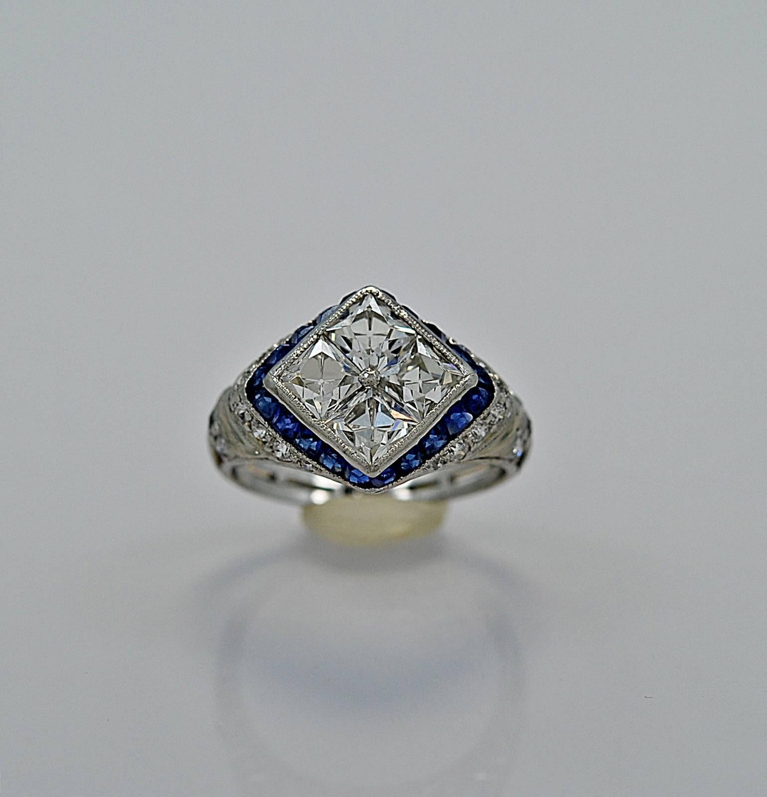 This extravagantly and uniquely designed Art Deco diamond and sapphire engagement/fashion ring features 1.60ct. T.W. of exceedingly rare antique French cut diamonds (c. 1915-1920) and only used by a select few high end designers like Tiffany & Co.,