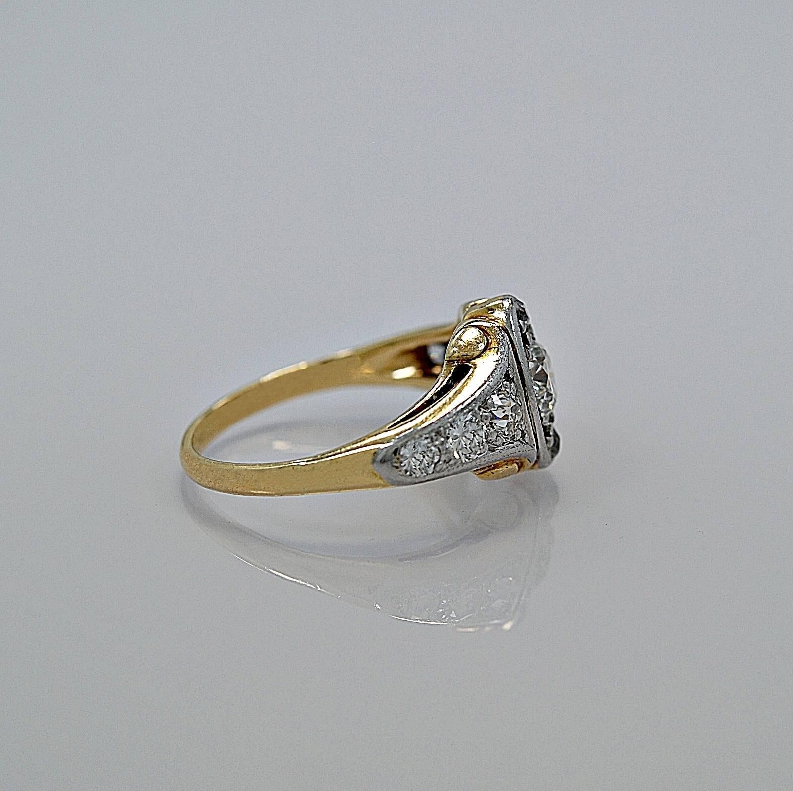 In our Tampa store, this item has a retail price of $6,595.

This Art Deco 14K/18K White/Yellow Gold diamond engagement ring features a .60ct. apx. center diamond with diamond melee on the top and bottom to give the illusion of a marquise shape