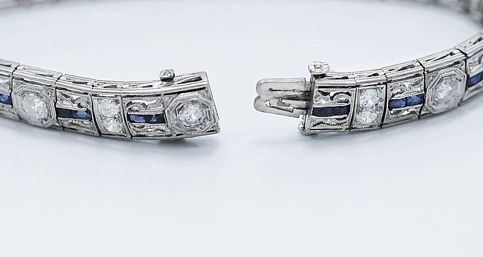 An early Art Deco diamond and sapphire Antique bracelet wtih 5.5 to 6.00ct. apx. T.W. European cut diamonds, F-G color and VS2-I1 clarity (100% eye clean). The baguette cut sapphires are natural and weigh 2.00ct. apx. T.W. and are a beautiful blue