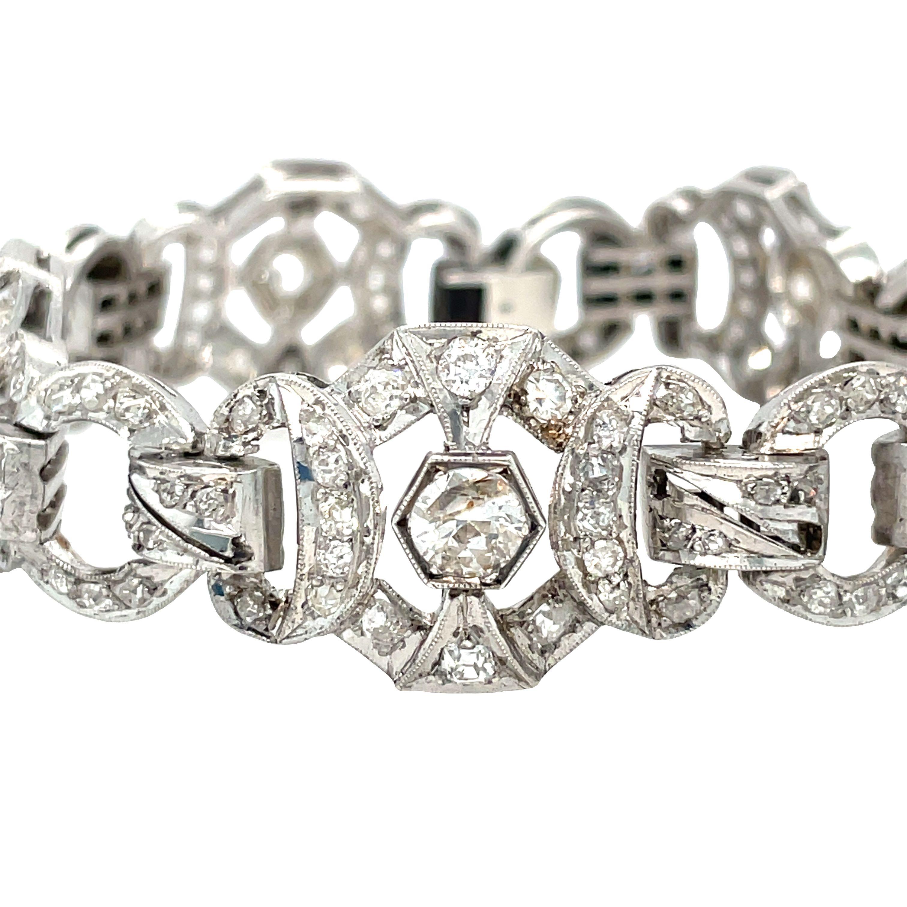 A very pretty Edwardian open link diamond bracelet sparkling with 136 bead set Old European and Mine cut diamonds. Mounted in silver?? with an approximate total diamond weight of 4.40 carats K-L-M color and I1 clarity. The stones are all prong set