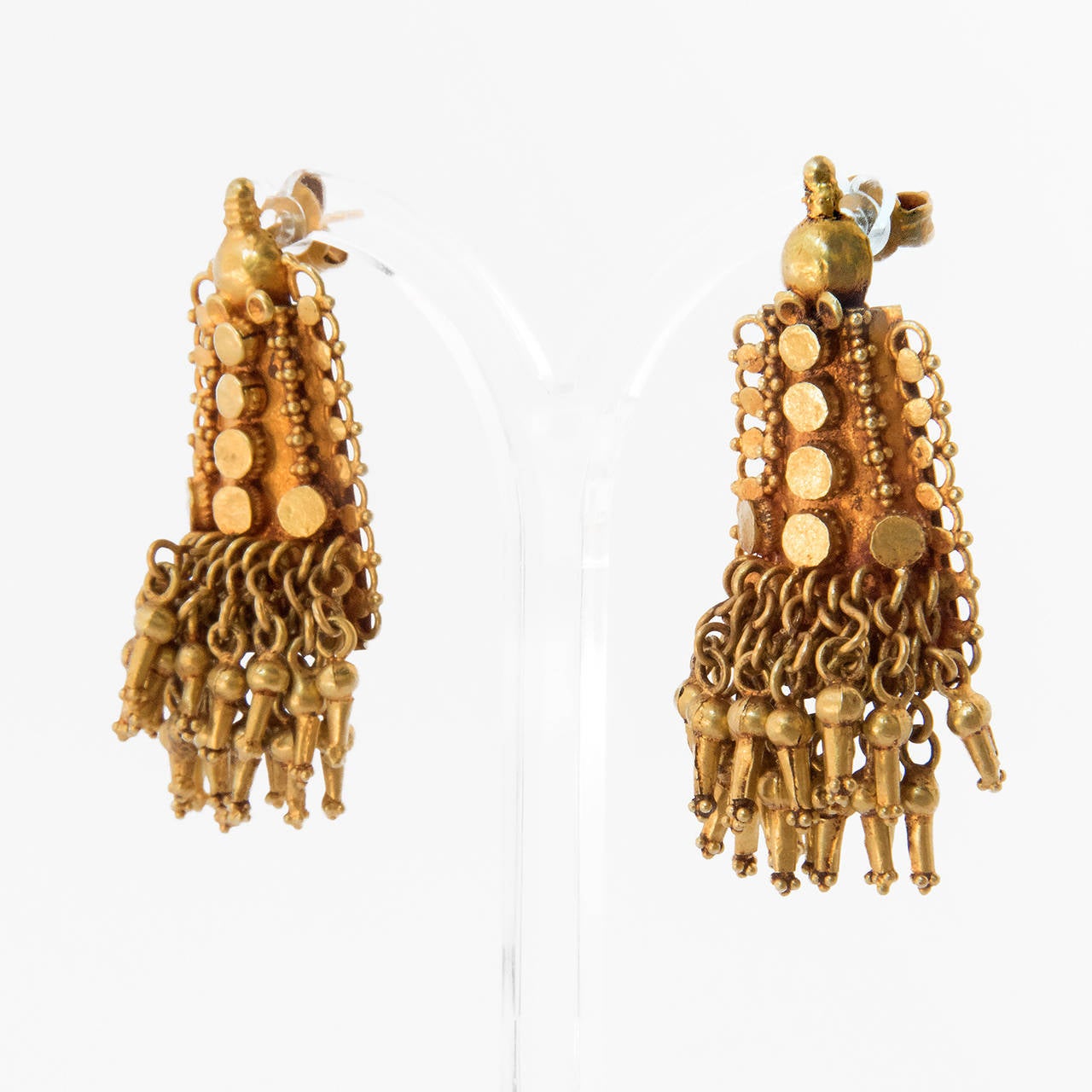 A pair of gold ear pendants, KOMBANJALI. 
South India, Malabar, early 20th Century

This type of ear pendants is a traditional design for South India, Malabari Mapilla Muslim community. Muslim relate the earring to the shape of a horn,