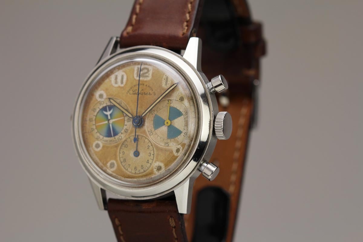 Abercrombie & Fitch stainless steel Seafarer chronograph wristwatch with manual-wind movement, screw-back case, aged silvered dial, Arabic 11, 12, 1 and dot markers, luminous baton hands, two registers with subsidiary seconds, plastic crystal, brown