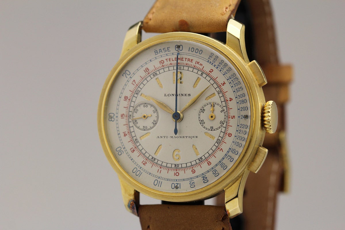 This is an exceptional example of a Longines chronograph from the 1940s in 18k yellow gold. I have never had one this nice. It is an extremely rare version with the 13ZN movement and sandwich dial. This oversized watch is in mint condition with an