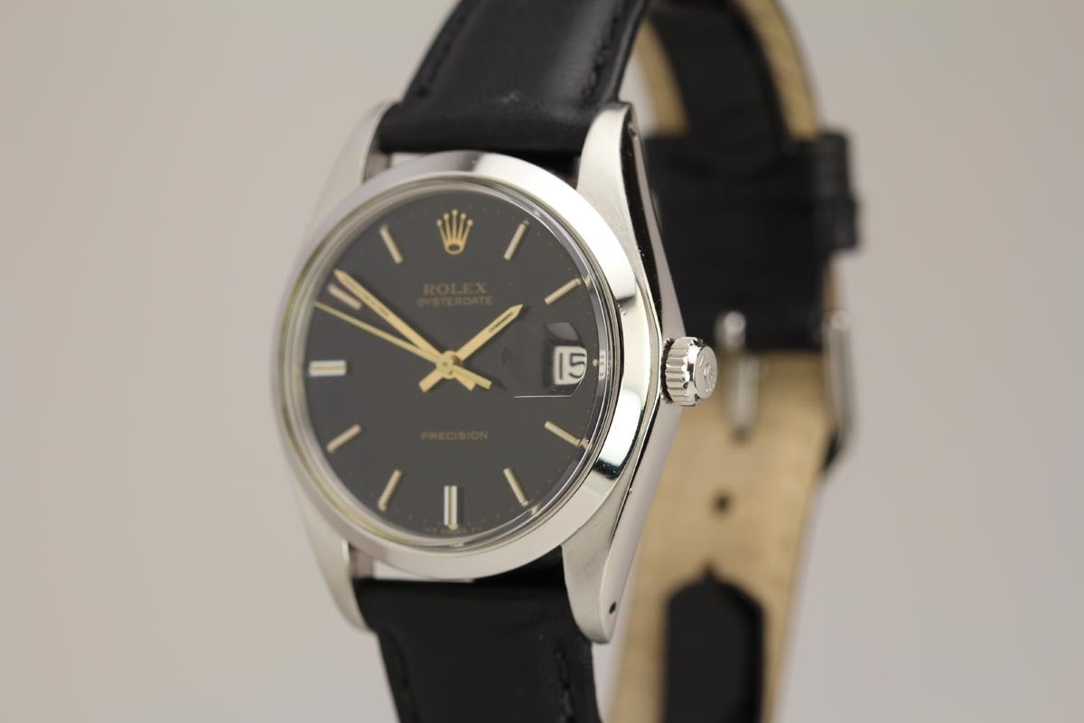 This is a beautiful example of a 1973 Rolex Manual Wind Oysterdate wristwatch. The condition is excellent. The original black dial with gilt writing is pristine. The watch also comes with its original box, papers and the original purchase receipt.