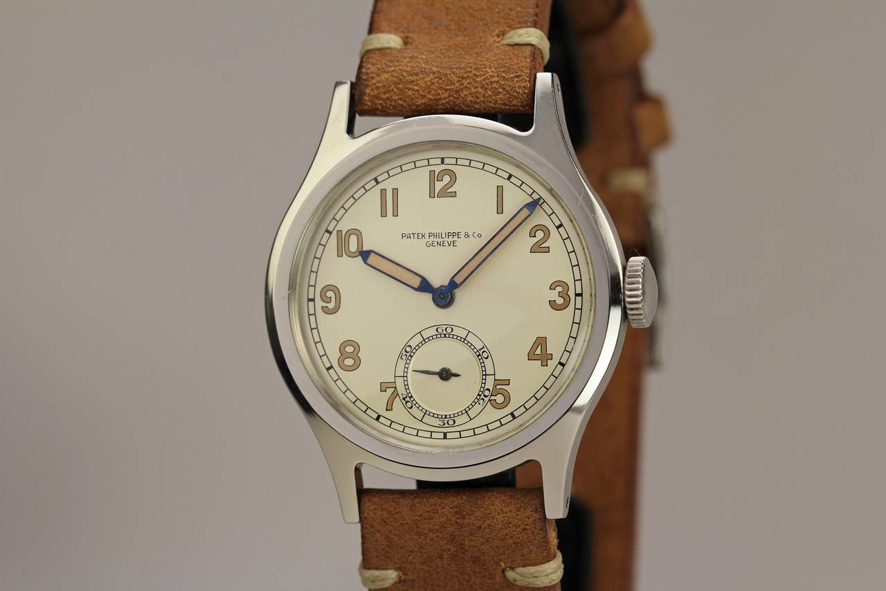 This is an extremely rare stainless Patek Philippe reference 565 from the 1940s. What is extremely rare about this watch is the dial configuration which has luminescent arabic numerals. The 565 typically has applied steel markers and to find one