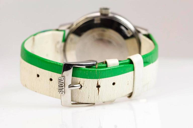 Bulova Spinnaker in stainless steel with green/white dial with day date apertures and is on a Bulova strap / buckle.  
