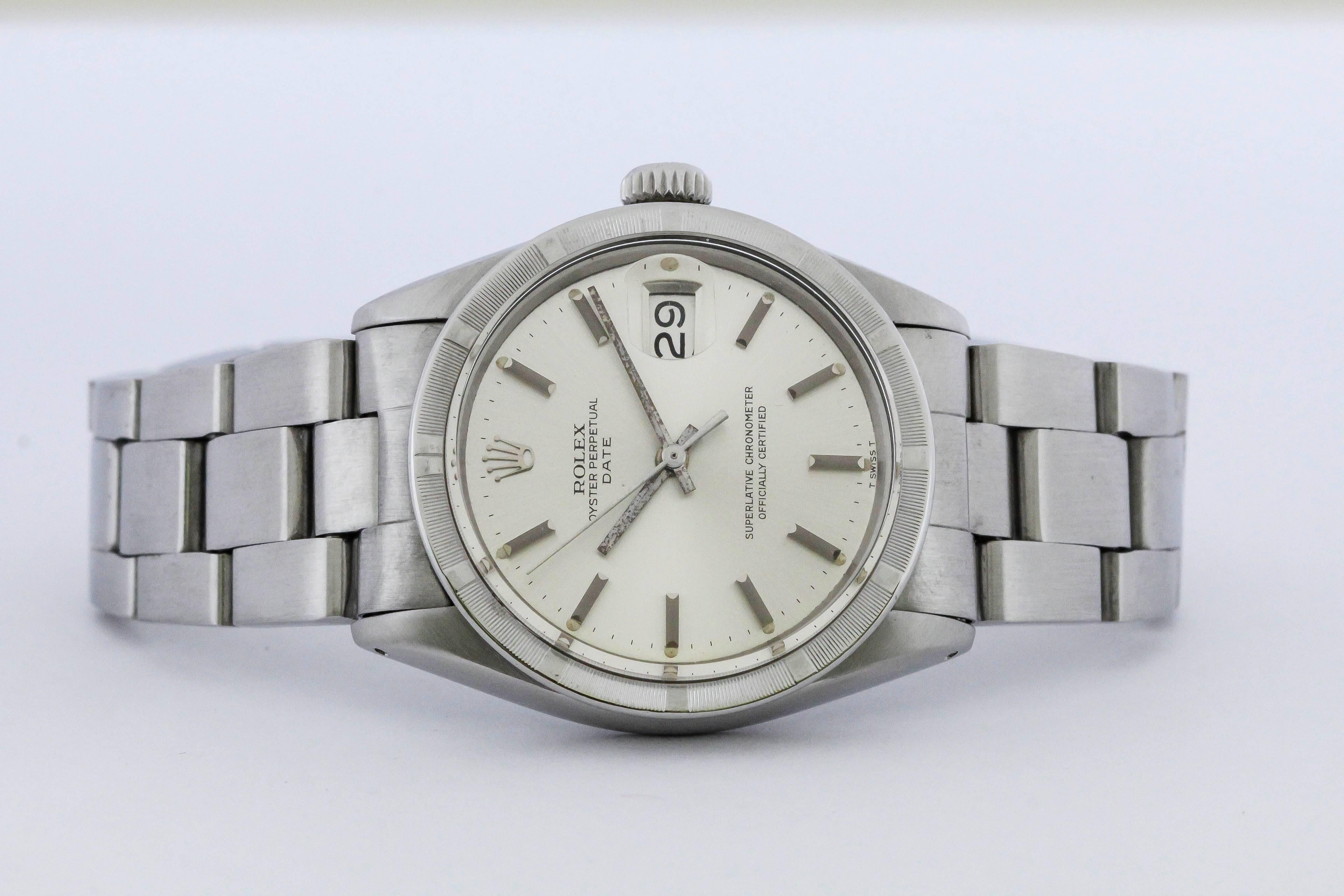 Rolex Date reference 1501 with engine-turned bezel, silvered dial,and on an oyster Rolex bracelet. Circa 1970