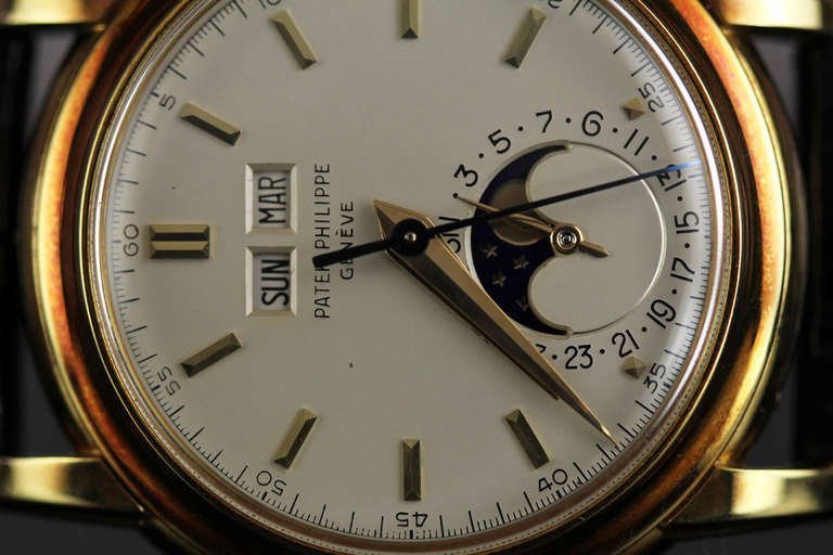 This is an incredible example of the rare Patek Philippe Ref. 2497 18k yellow gold perpetual calendar moonphase wristwatch with center seconds from the 1950s. This particular example is unpolished and has a mint original dial. To find an unpolished