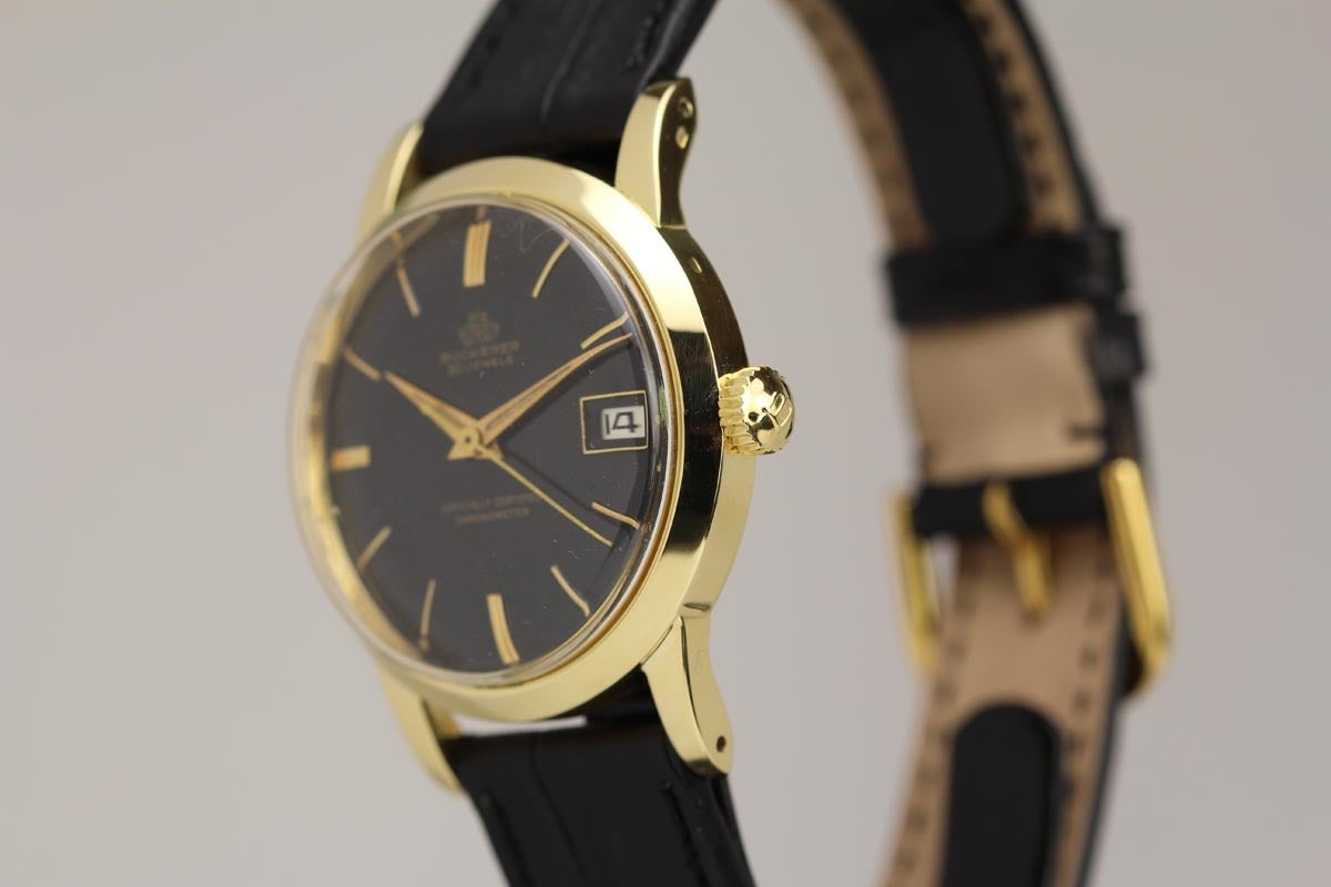 Bucherer chronometre in yellow gold with an original gilt black dial from the 1950s