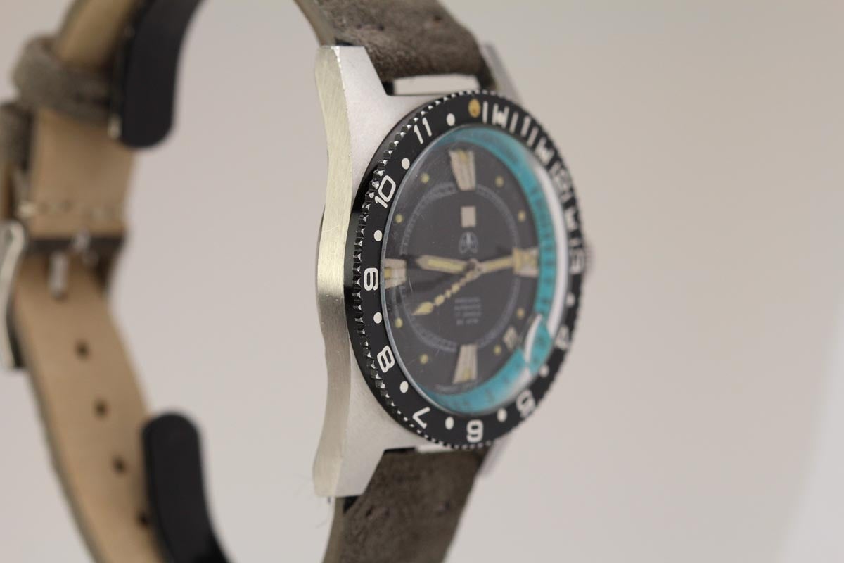 This is a vintage Ollech & Wajs Diver's watch. Ollech & Wajs is a company from Switzerland that started selling  watches in about 1956 that catered to the sportsman. O&W became very popular with the US soldiers in the 1960's & 1970's. This is