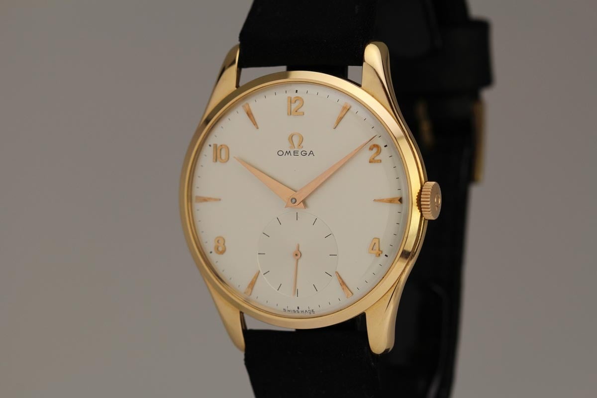 This an amazing example of an oversize Omega calatrava in 18k rose gold from the 1950s.  It is a well preserved Omega  with an unpolished case and a beautiful original dial.
