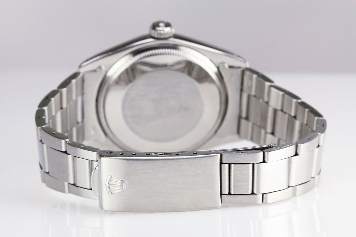 This is a classic Rolex Stainless Steel Date from 1970. This watch has an original silvered dial with slash markers and a smooth bezel and comes on an original Rolex oyster bracelet.