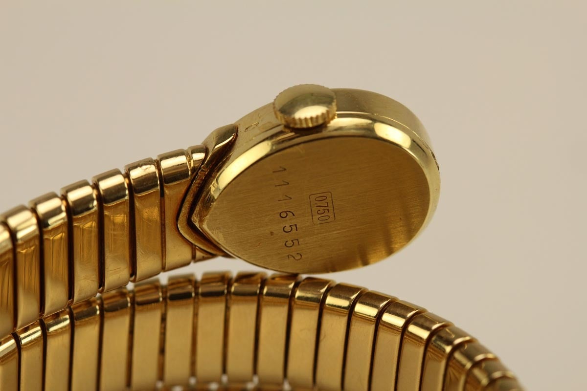 This is a rare find, a yellow gold Juvenia Tubogas Snake bracelet / watch retailed by Bulgari in the 1970's  The teardrop measures 14mm wide x 20mm and the bracelet  9.87mm wide.

We have another Juvenia Tubogas Snake bracelet with a gold dial and