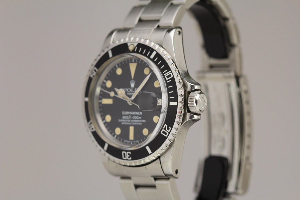 This is a vintage Rolex Submariner reference 1680 in excellent condition. The dial and hands have beautiful patina. It comes on the original heavy oyster flip lock bracelet.