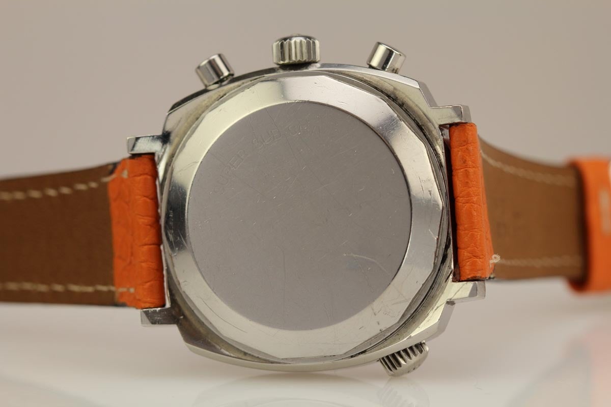 This is a rare sub-sea Movado chronograph from the late 1960s. This Movado chronograph is in excellent condition with an original black and orange dial. The sub-sea chronograph is powered by Movado's manual wind caliber 146hp. This is a very