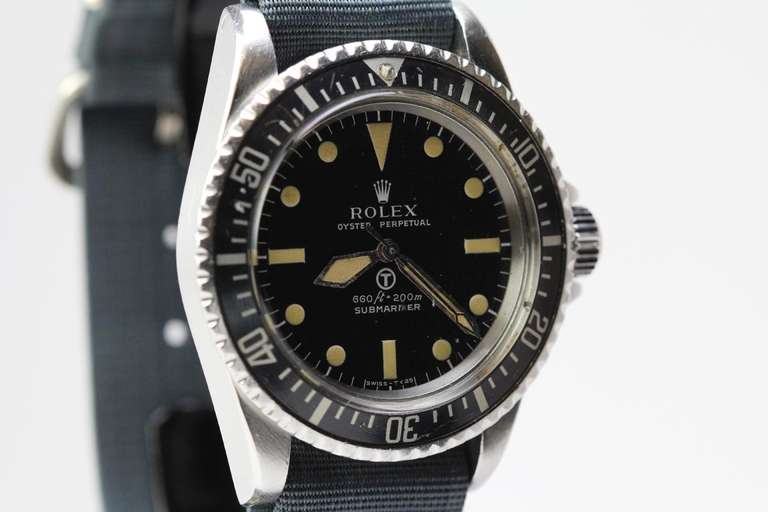 This is an excellent example of the highly sought-after Rolex Submariner, Ref. 5513, produced for the British Military from the mid 1970s. This model has distinctive hands, dial, and case. The original dial of this watch is in excellent condition