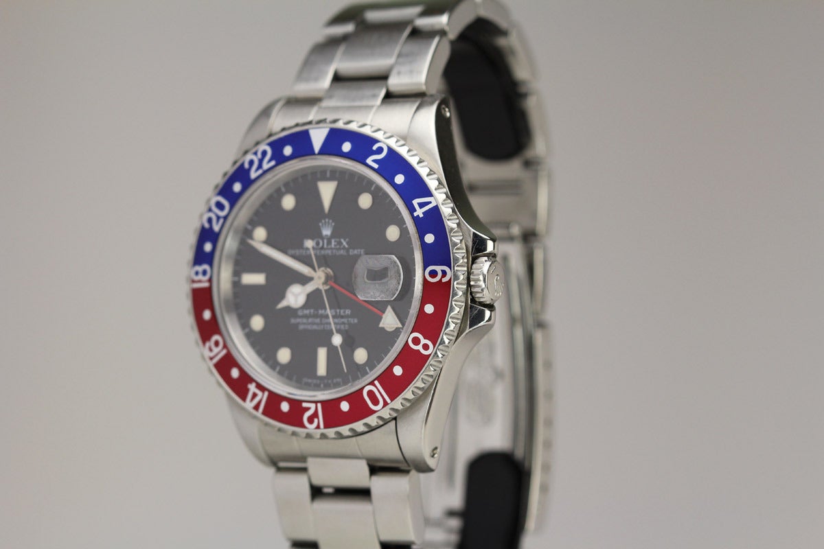 This is a Rolex Oyster Perpetual Date GMT Master with Blue/Red Bezel, on heavy Stainless Steel oyster bracelet. This watch dates to 1989.