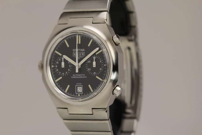 Heuer stainless steel Cortina chronograph wristwatch, Ref. R 110.233, with original black dial and date, automatic movement, integrated stainless steel Heuer bracelet with folding clasp, circa 1970s.