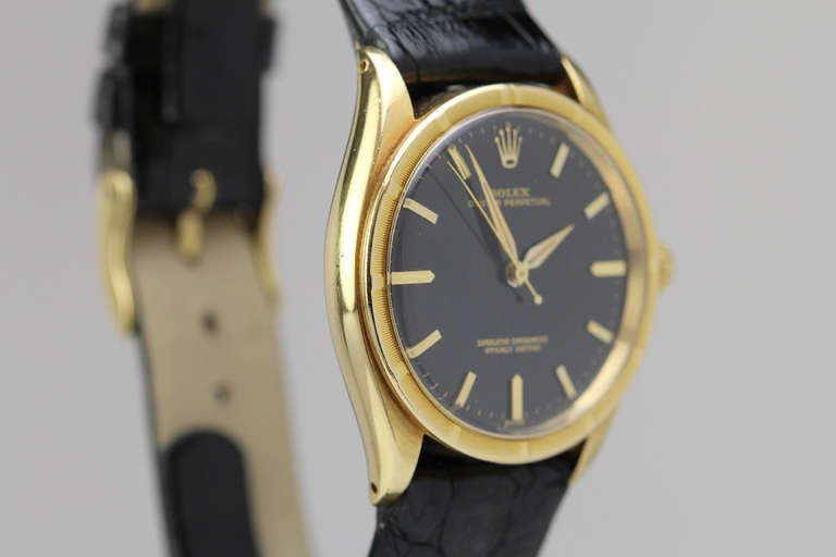 Rolex Yellow Gold Chronometer Wristwatch with Black Dial Ref 1007 circa 1960s In Excellent Condition In Miami Beach, FL