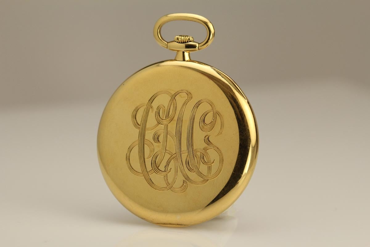 Elegant Patek Philippe Geneve yellow gold open face pocket watch from the 1940's.