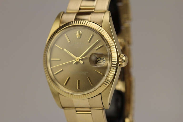Rolex 14k yellow gold Date wristwatch, Ref. 1503, with an automatic movement on an Oyster rivet bracelet, circa 1978.