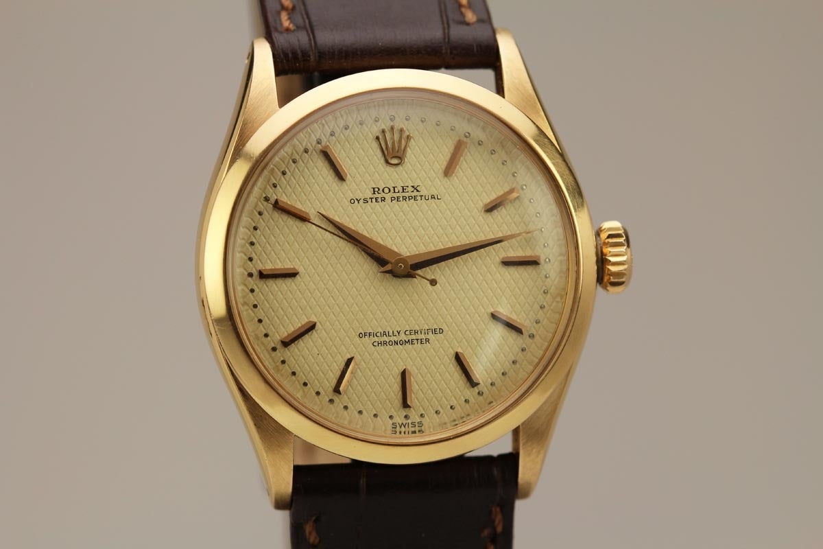 This is an exceptional example of a Rolex oyster perpetual reference 6284 in 18k rose gold from the 1950s. The watch has an amazing textured dial in mint condition and the case is unpolished. It is very difficult to find this reference in such mint
