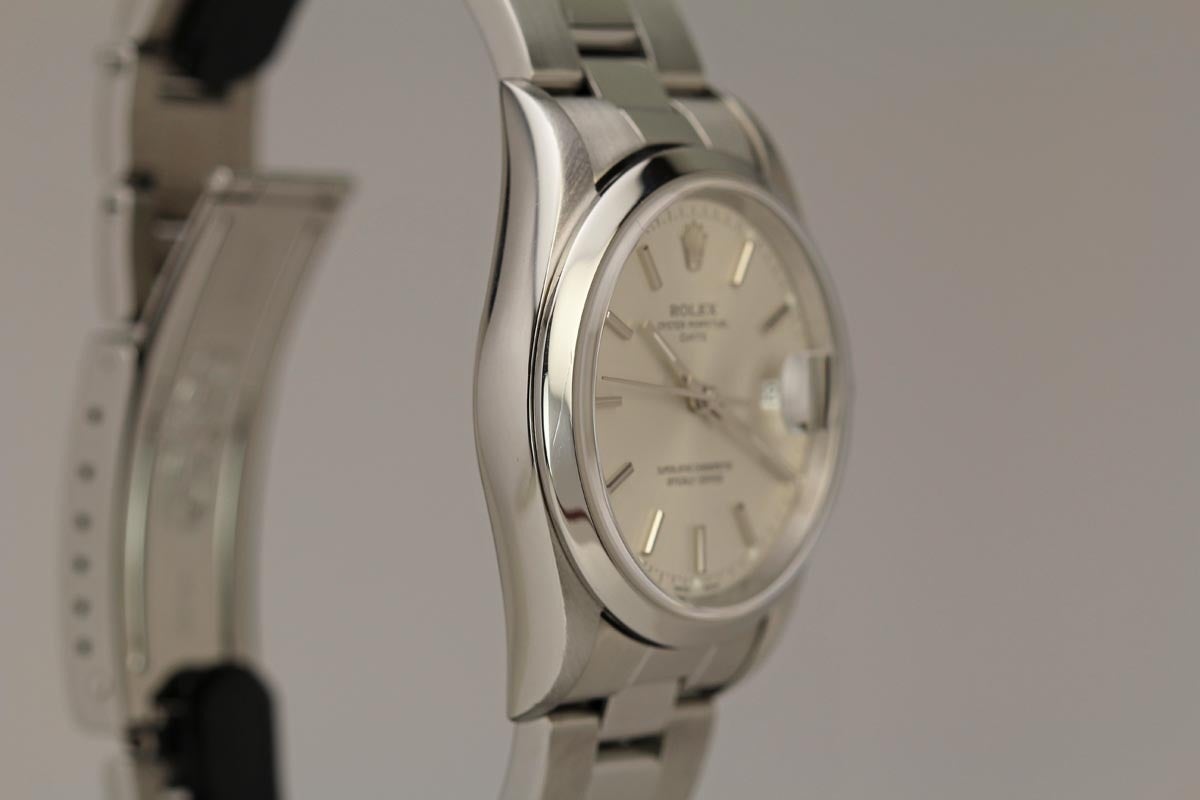 Rolex Midsize Date reference 15200 with a silvered dial, smooth bezel, and Rolex oyster bracelet.