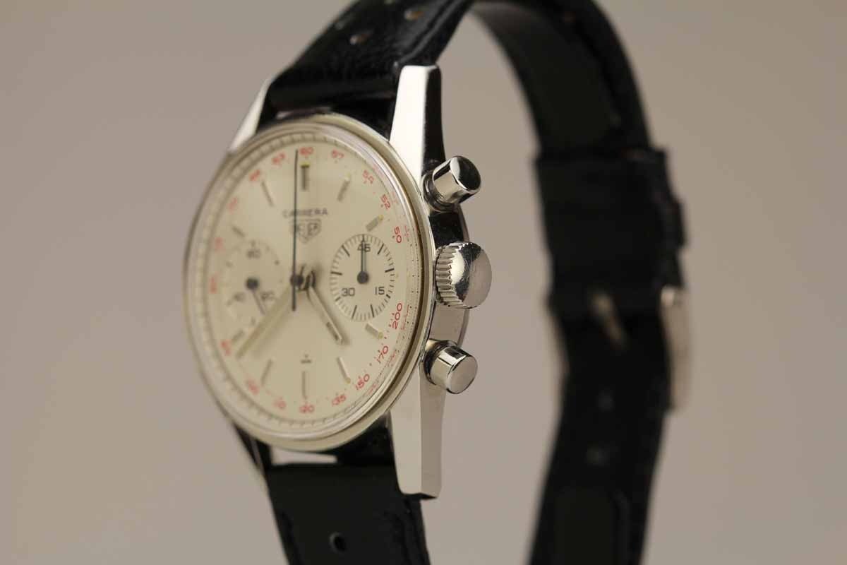 This is an excellent example of a Heuer Carrera reference 3647 two register chronograph with a red tachymeter scale from the late 1960s. The original dial is in excellent condition and the case is very sharp with its original lines. The watch comes