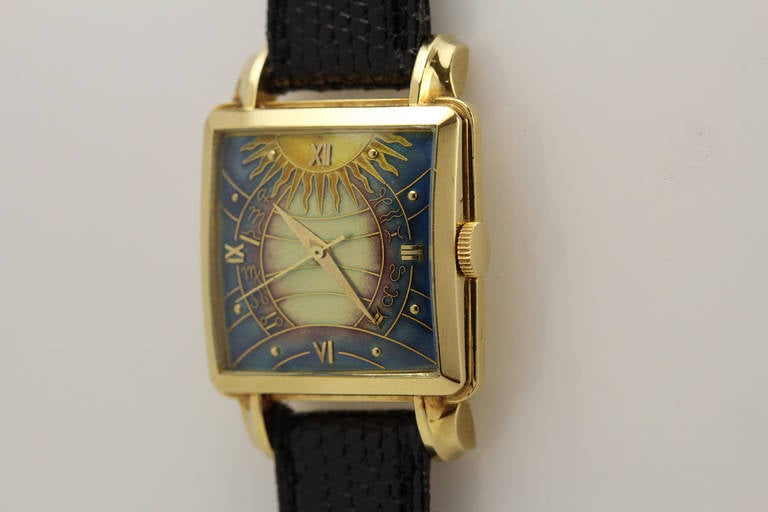 This is an extremely rare square Gubelin watch from the 1950s with an original cloisonne dial in 18k yellow gold. It is in mint condition with an unpolished case and a mint dial with no damage or cracks. The watch is powered by an automatic movement