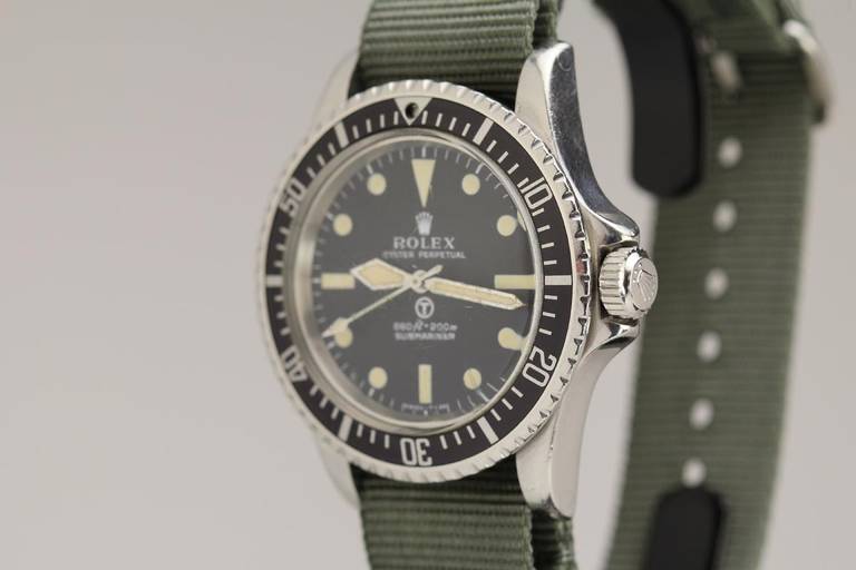 This is an excellent example of the highly sought-after Rolex Military Submariner, Ref. 5513, produced for the British military from the mid 1970s. As seen in the picture the British Mil-Sub has distinctive hands, dial, and case. 

The original