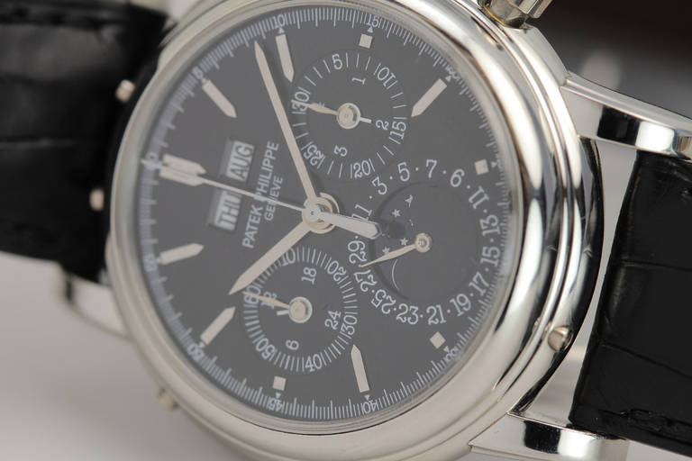 This is a rare and exceptional Patek Philippe platinum perpetual calendar split-second chronograph wristwatch, Ref. 5004P, from 2008. 

The 5004 is a highly complicated timepiece featuring a split-second chronograph and perpetual calendar with