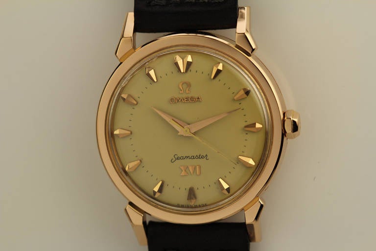 This is the Omega Seamaster XVI, Ref. 2850SC in 18k rose gold with a cross on the back of the case, beautiful faceted dog-leg lugs, and is in excellent condition. The beautiful original dial has raised faceted markers, Roman numerals indicating the