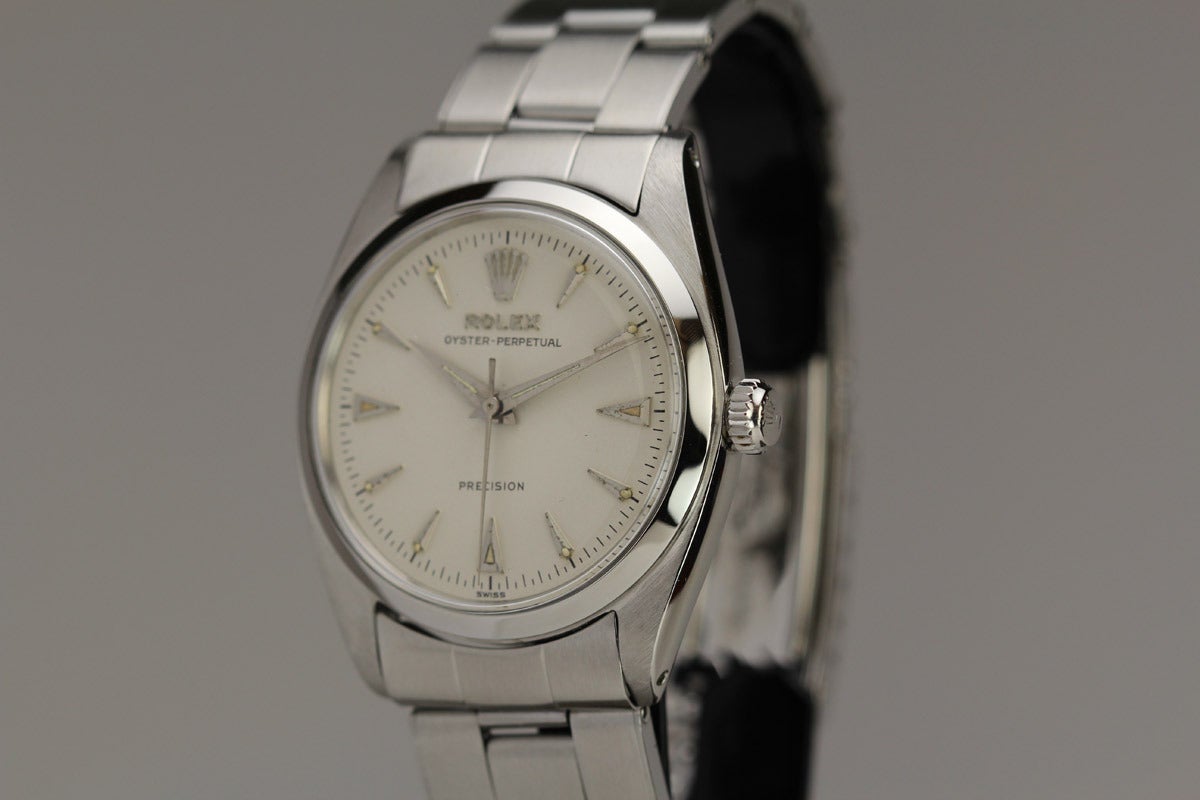 Rolex stainless steel Oyster Perpetual Precision wristwatch, Ref. 6556, with a white dial, smooth bezel, rivet oyster bracelet.