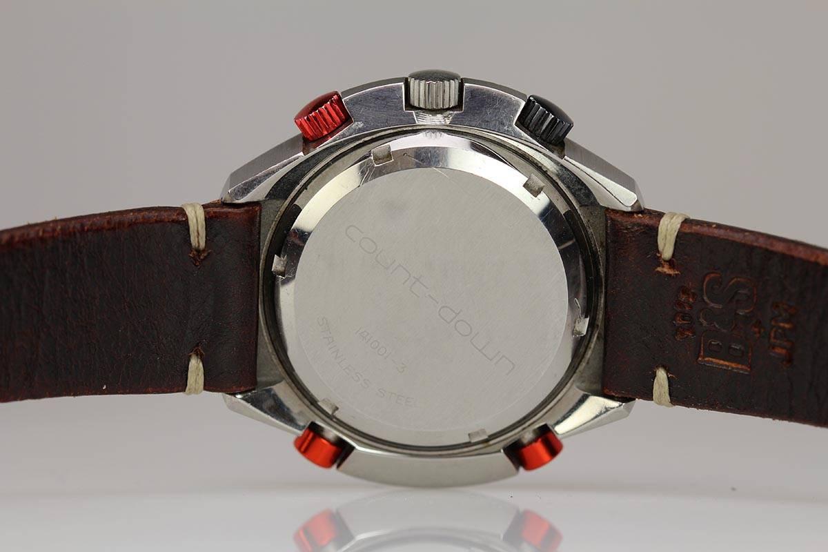 This Hamilton Count-Down GMT Chronomatic has a large 48mm satin brush finish case, anodized red button and features a chronomatic cal.14 with additional GMT hand and two crowns used to rotate 24h and time-zone bezel rings. This watch is in mint