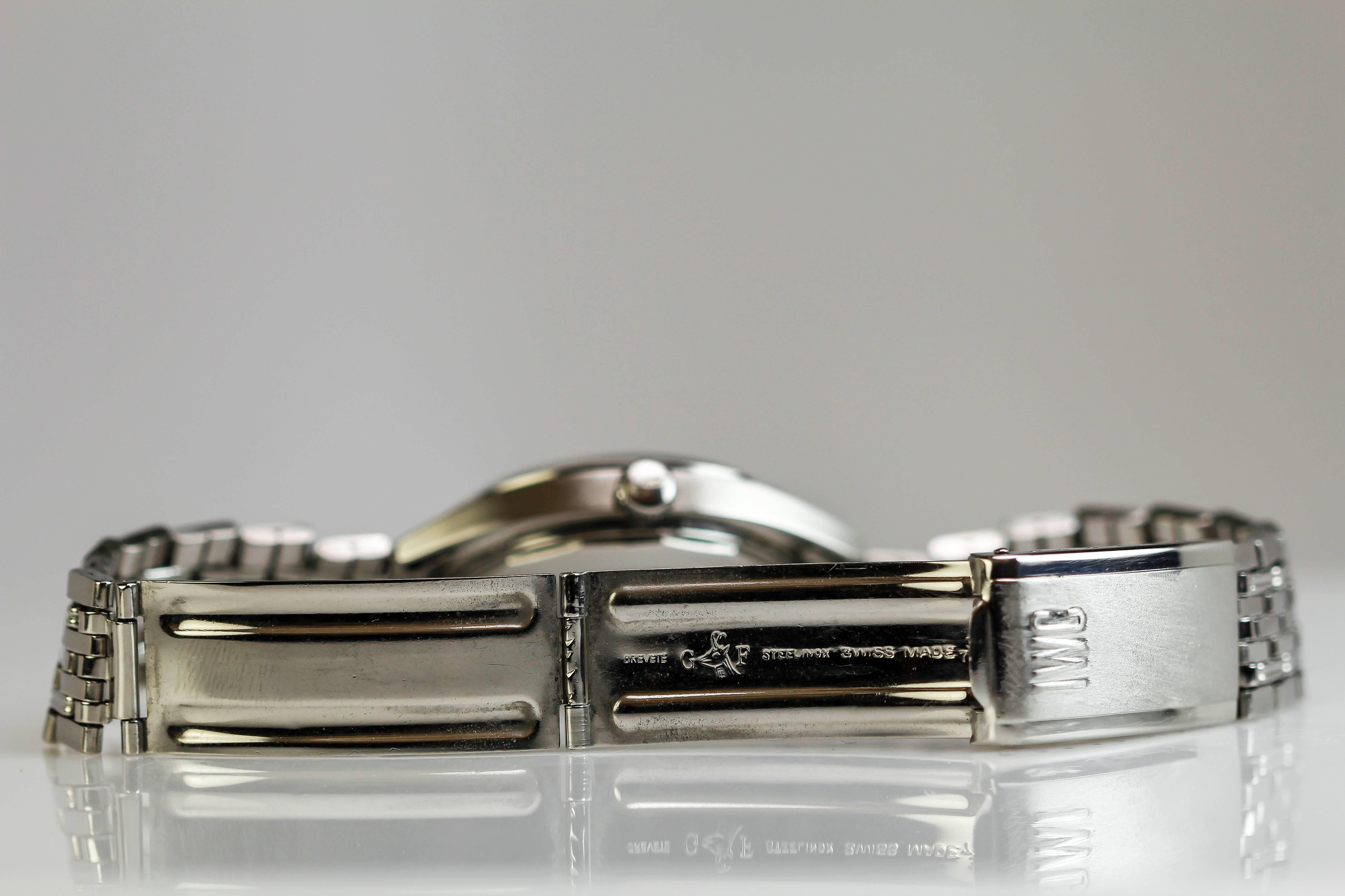 International Watch Company, IWC Yacht Club with a blue metallic dial, date aperture, and is on an IWC stainless steel bracelet. 


