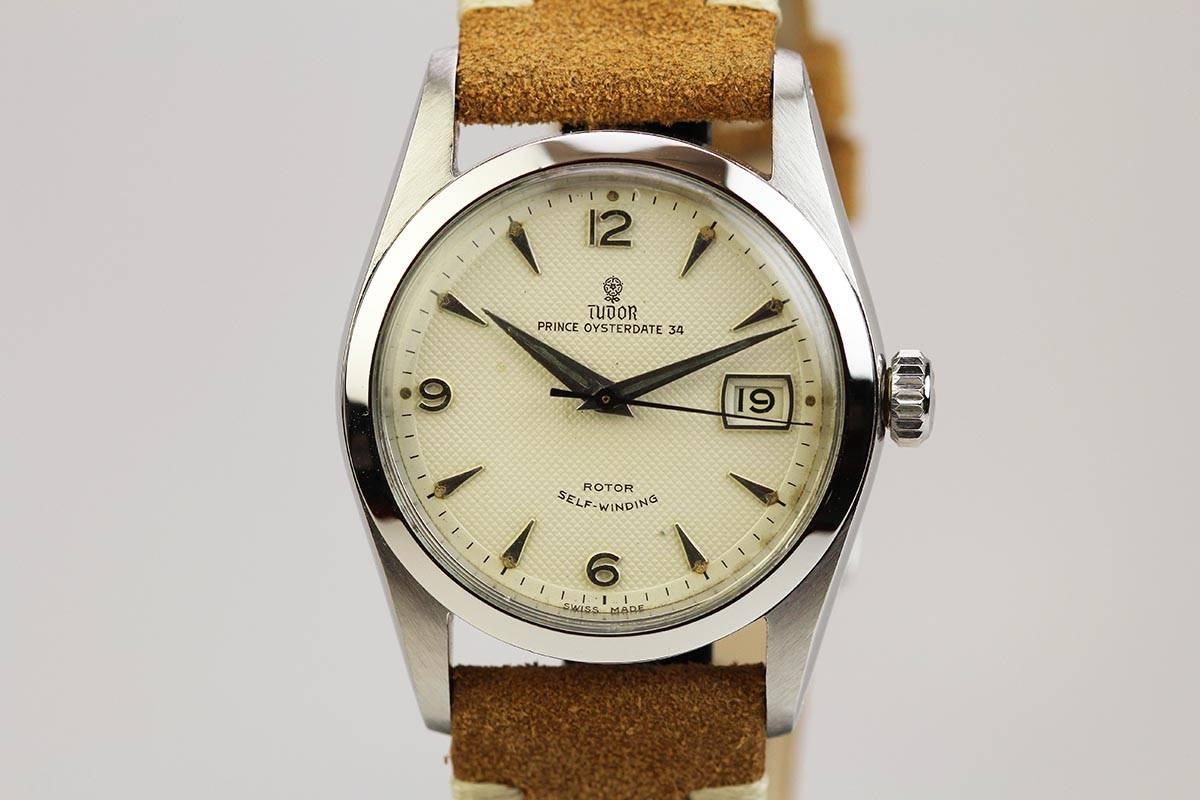 This is a classic Tudor Prince Oyster Date 34 in stainless steel with a smooth bezel, original Rose honey comb dial, and run by an automatic movement.