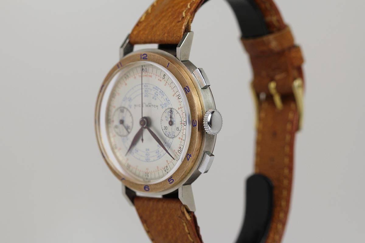 This is a stunning two-tone, Nice Watch Company, two register chronograph from the 1940’s.