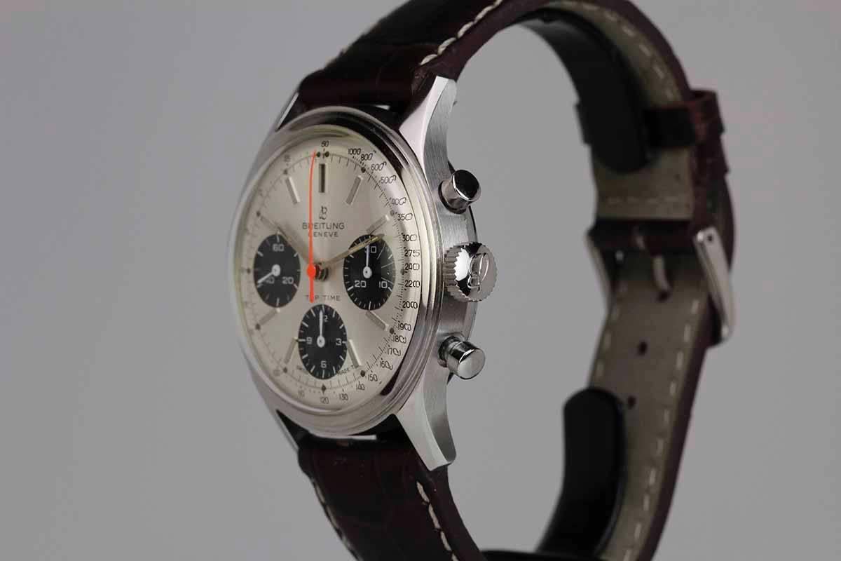 Breitling Top Time Ref 765 in stainless steel with a chronograph feature, silvered/black dial aka Panda, run by a caliber 178 manual wind movement. 
