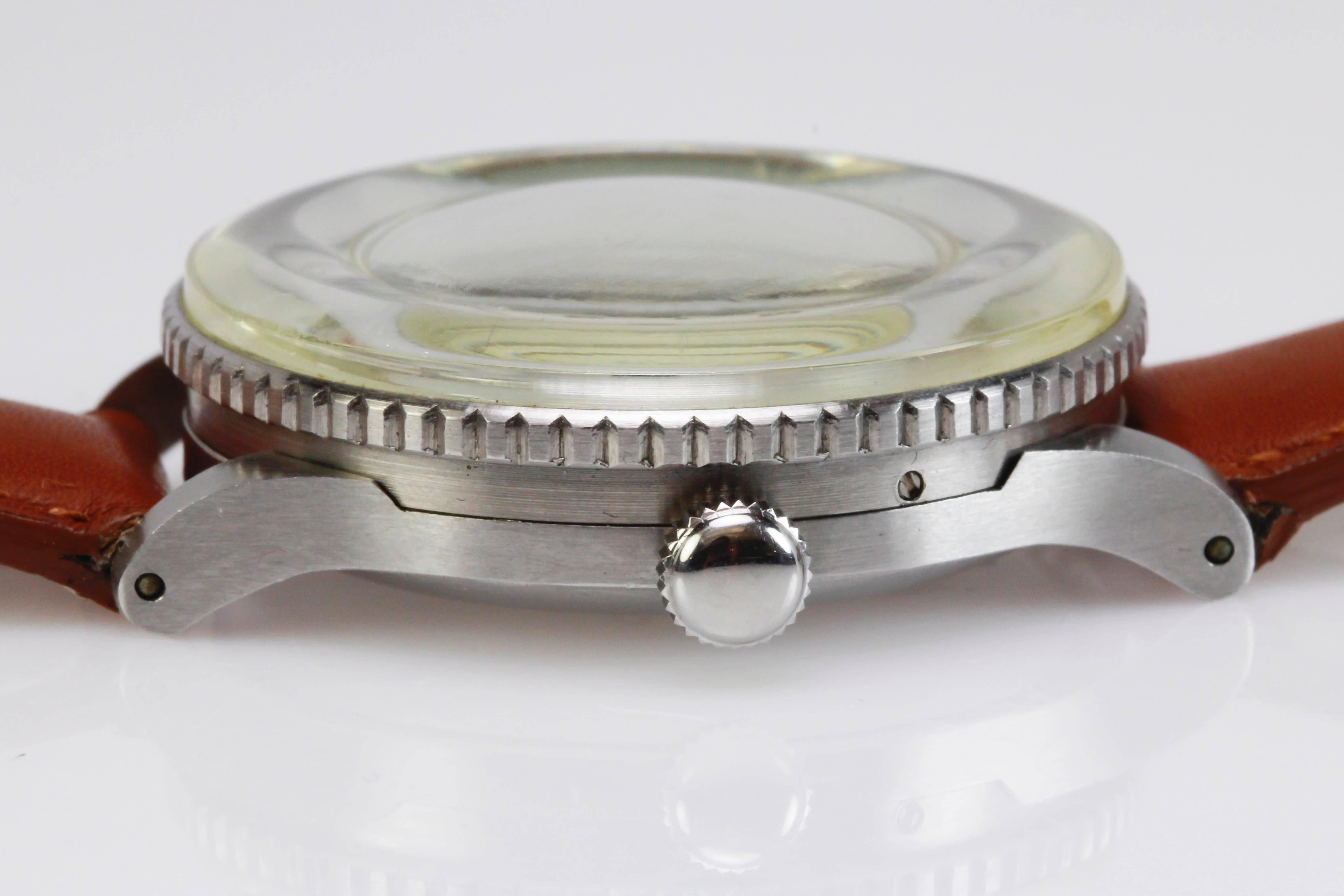 Juvenia  Arithmo with a coin edge rotating slide Rule Bezel, 1st Calculator Watch. This has a manual wind movement.