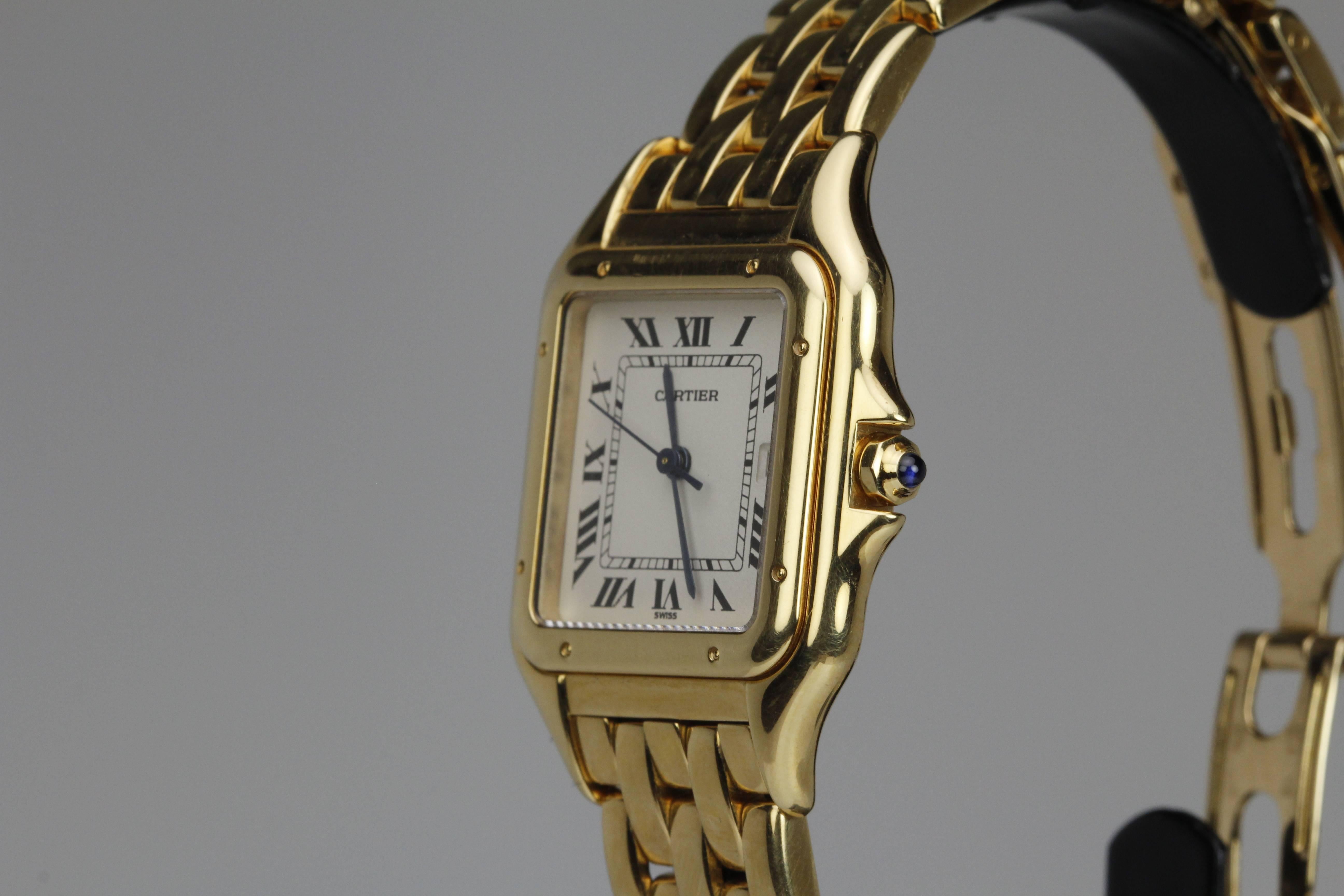 Cartier Yellow Gold Panthere with a quartz movement. This is a medium size case and the bracelet has extra links. Width of the case measures 27mm without the crown guard and length measures from tip of lugs.
