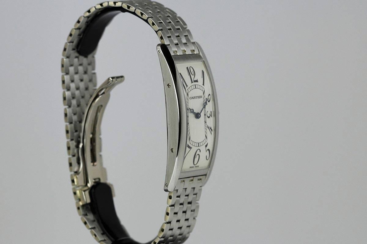 This is an elegant Cartier Platinum Tank Cintrée,  Made in a limited edition of 50 pieces. The rectangular curved platinum case and is on a platinum bracelet with 18K white gold Cartier deployant clasp.