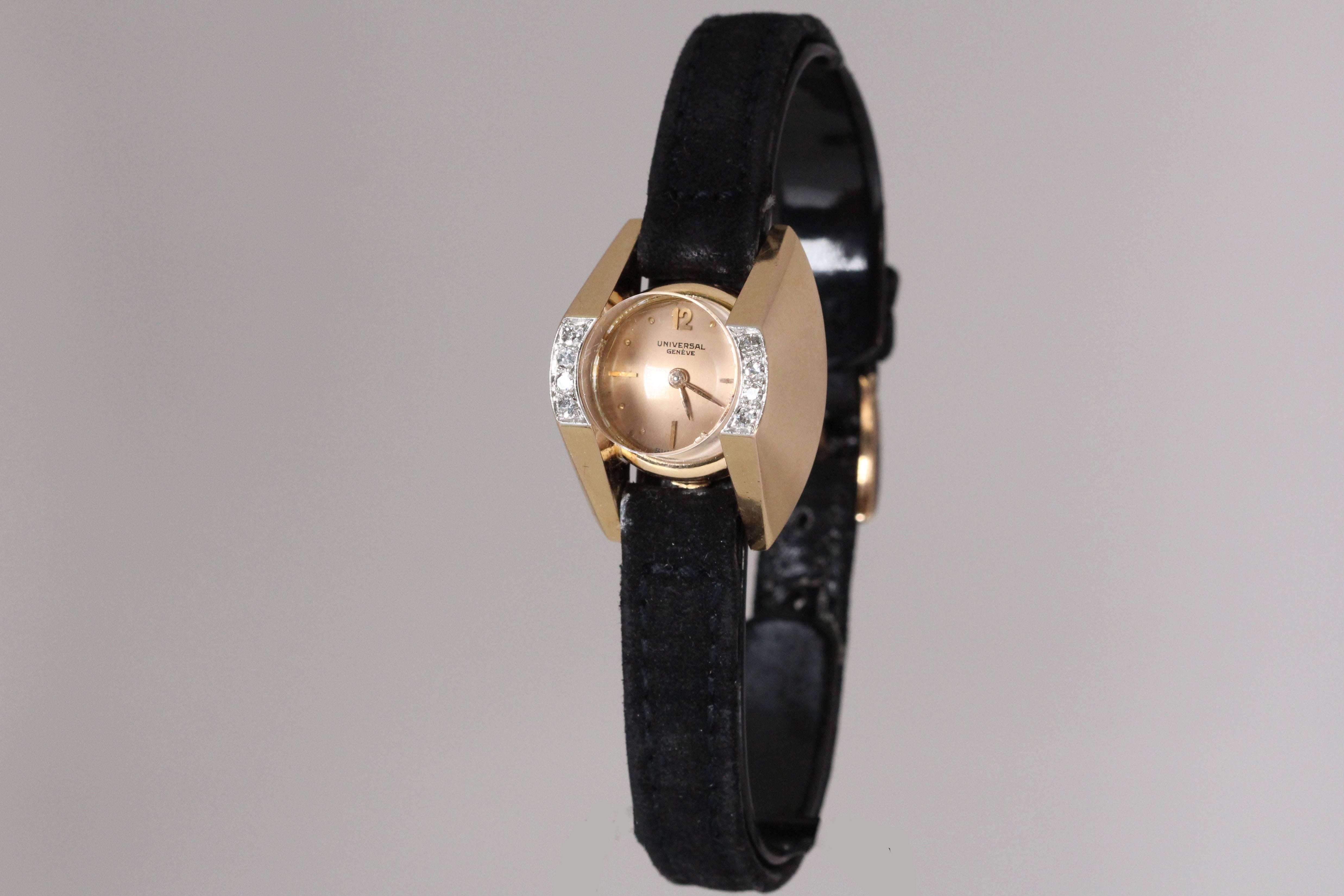 Stylish vintage Universal Geneve lady's yellow gold  and diamond wristwatch.  Crystal diameter is 13mm.