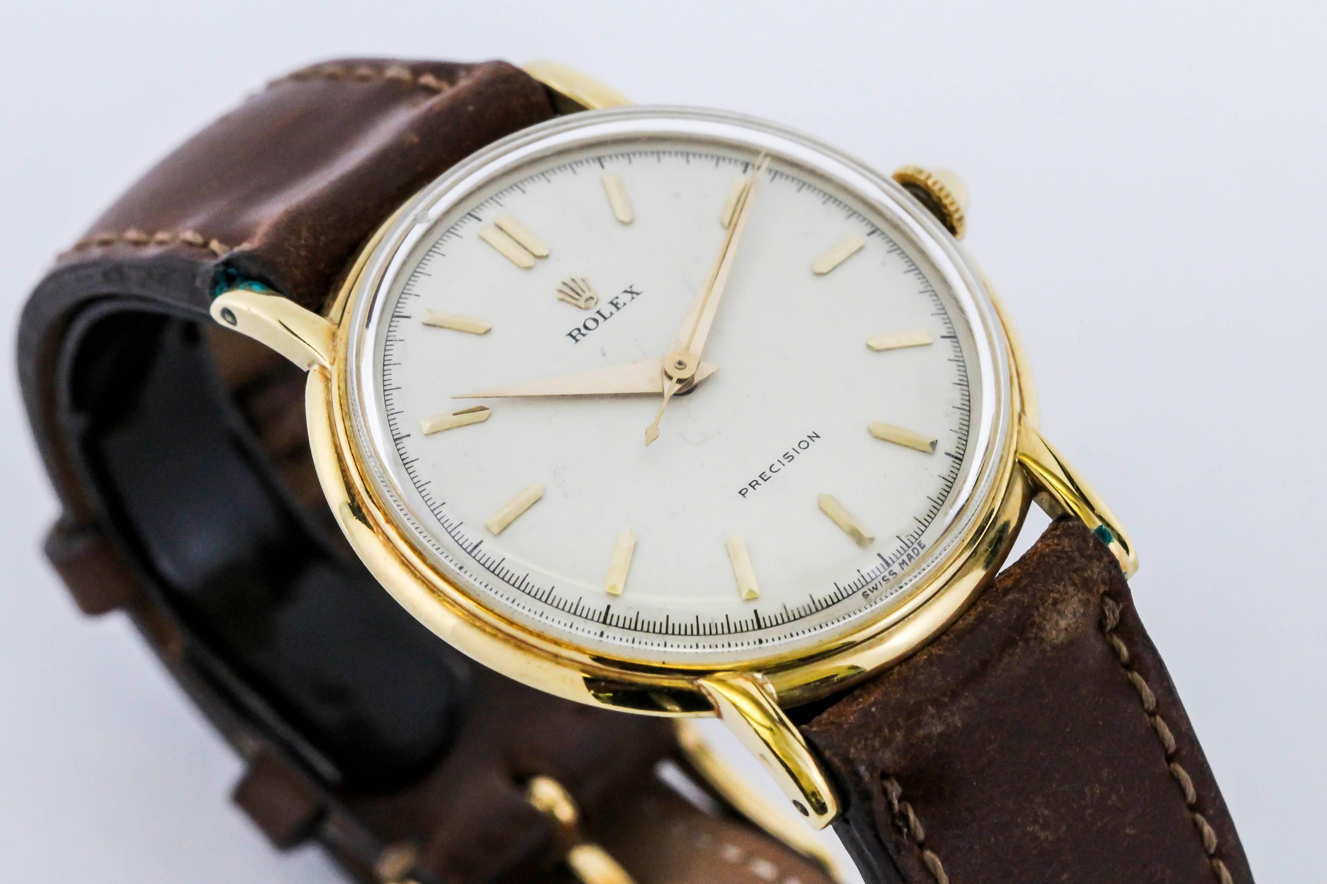 Brand: Rolex
Model: Precision
Ref: 4222
Year: 190s
Material: 18k Yellow Gold
Dial:  Original Ivory with applied Pointy Markers
Dimensions: 35mm 
Watch Movement: Manual Wind
Bracelet/Strap: Brown Cordovan Leather
Box/Paper: No