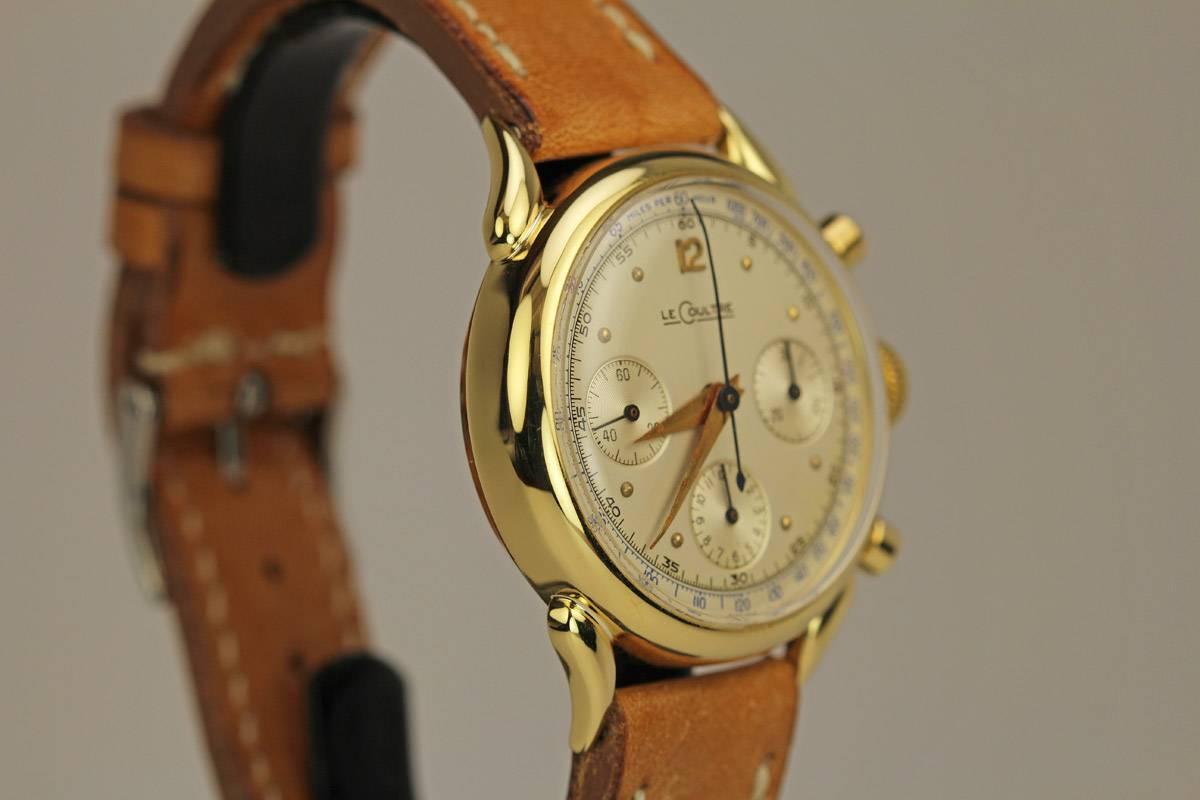 This is a beautiful and fancy lug LeCoultre 18k yellow gold Chronograph. The case and lugs on this watch are excellent and the dial is all original. The watch is powered by the famous Valjoux 72 manual wind movement.