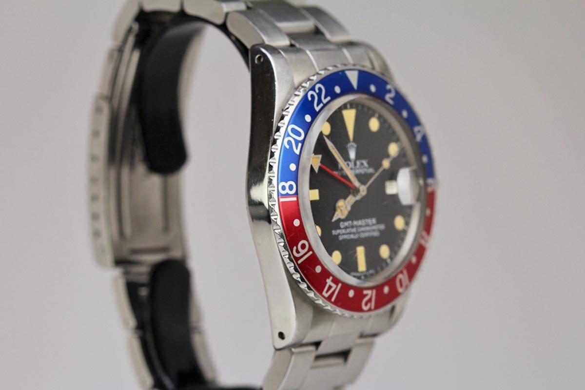 This is  a Rolex GMT reference 16750. The case is in excellent condition and the dial has beautiful patina. The watch comes on the original Rolex heavy Rolex oyster bracelet.