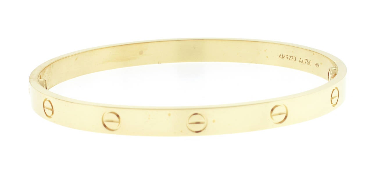 The Cartier bracelet is a universal symbol of love and commitment. Originally purchased in December 2014 the bracelet is in as new condition. All original boxes, instruction and certificate of authenticity. 18kt yellow gold size 21