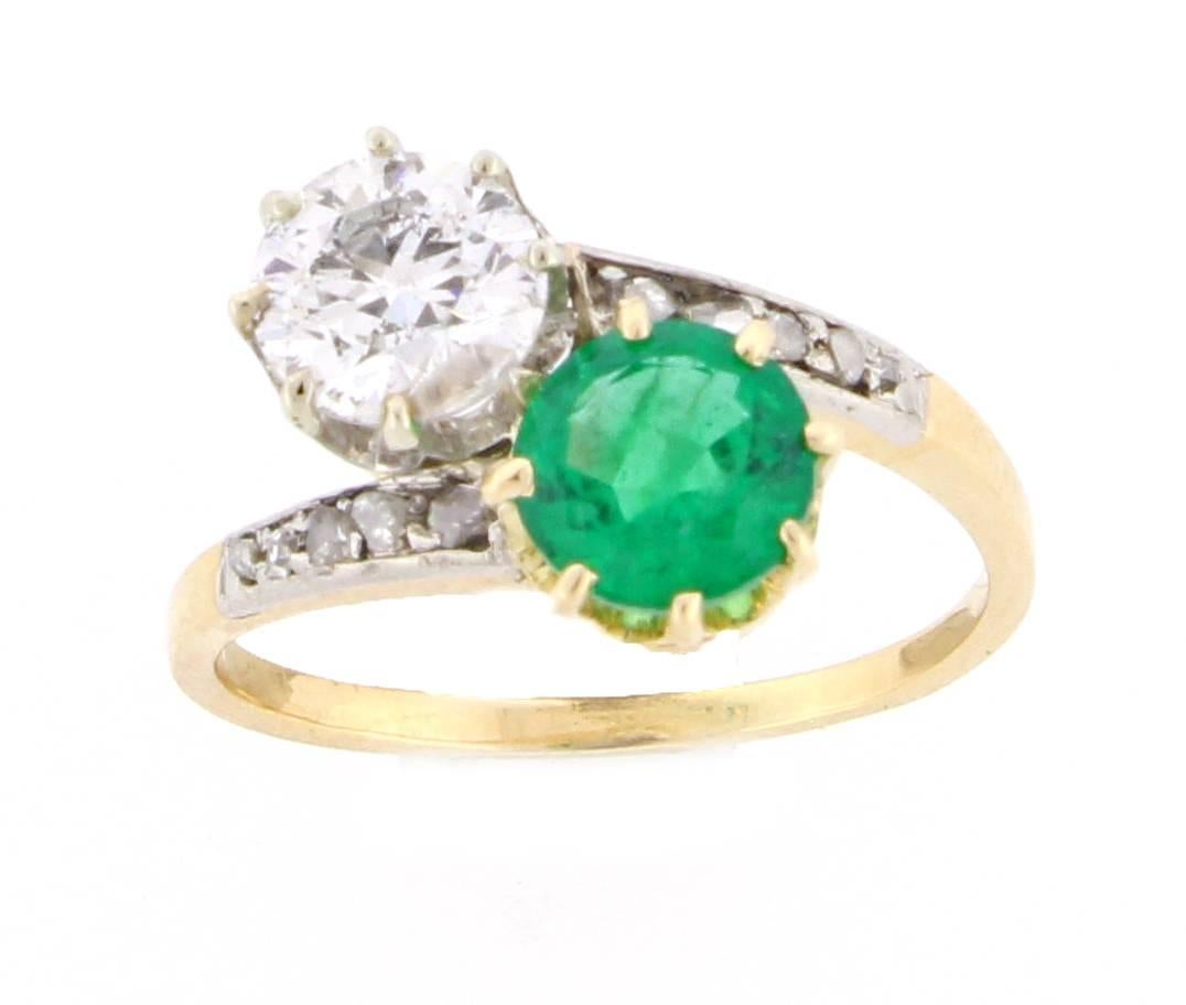 The ring features a round emerald weighing .98 carats and an old European cut diamond weighing .97. The diamond is H color and SI2 clarity. Set in Platinum over 18 karat gold, Circa 1890