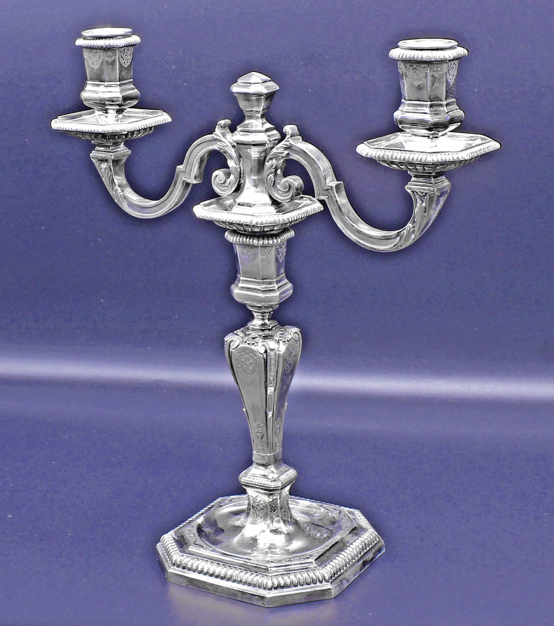 From the  master silversmiths  of the house Lapparra a pair of magnificent  convertible  candelabras.  Meticulously crafted from 950 silver  with intricate hand engraving. 4 ¾ square base  12 inches high. Solid 950 silver 91.35 ounces